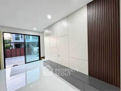 Modern living room with sleek design and large sliding glass doors