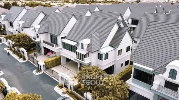 Modern suburban homes with sleek design and lush greenery in a quiet neighborhood.