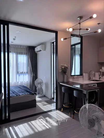 Modern bedroom with sleek design and ample natural light