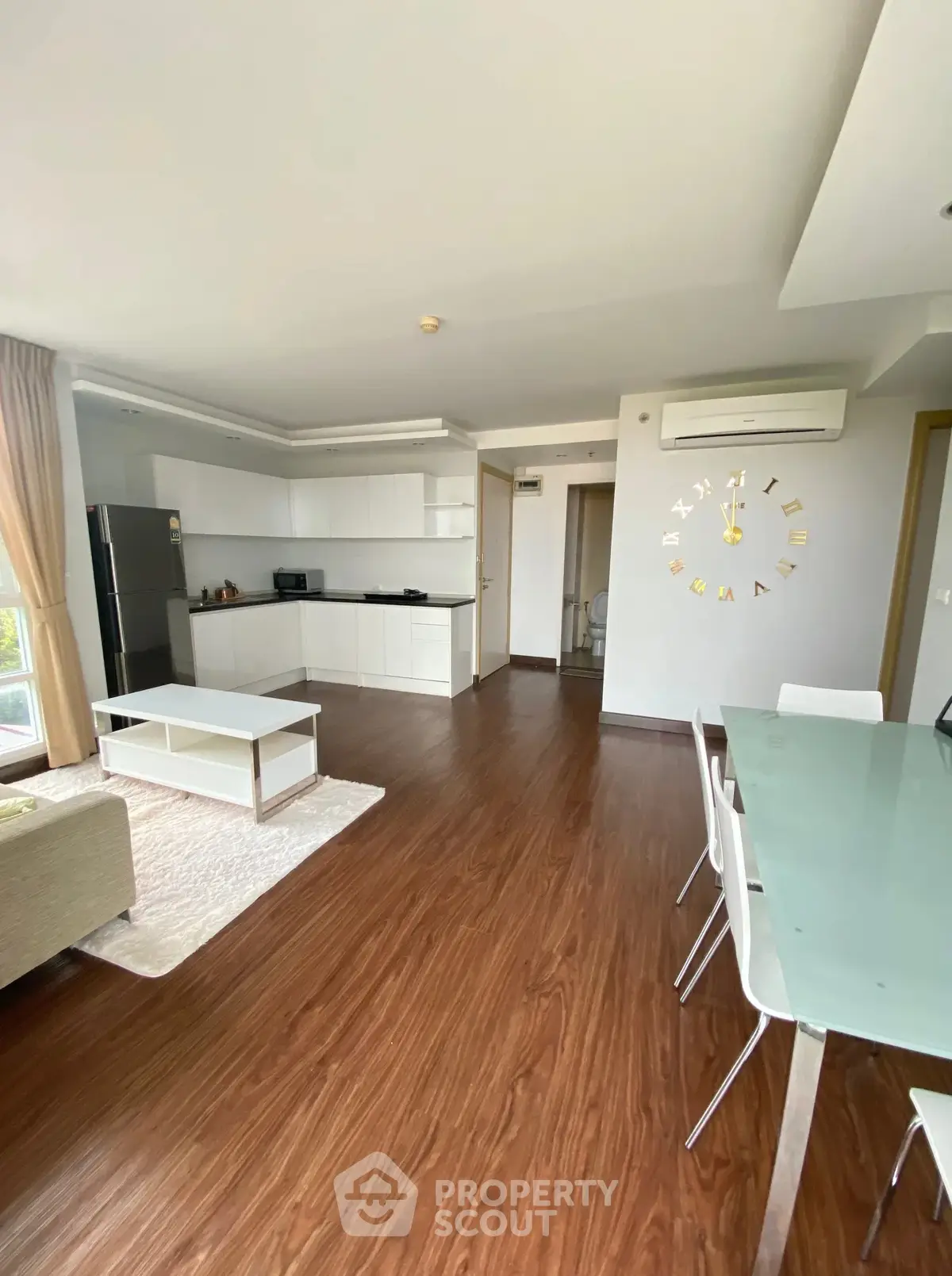 Spacious modern living room with open kitchen and stylish decor