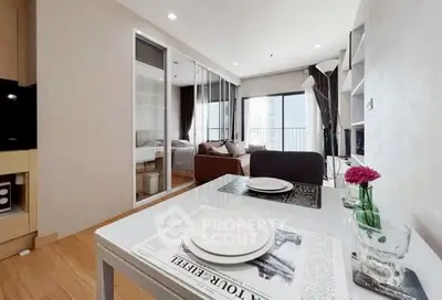 Modern open-plan living room with dining area and balcony view