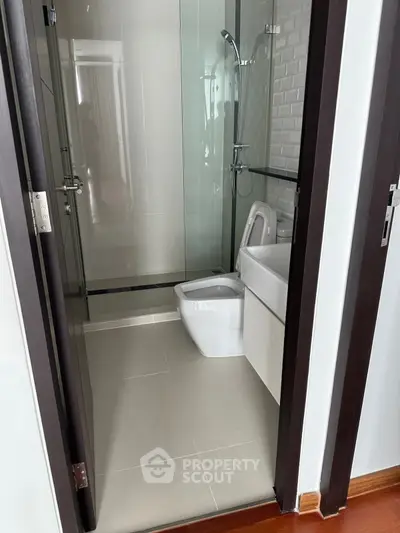 Modern bathroom with glass shower and sleek fixtures