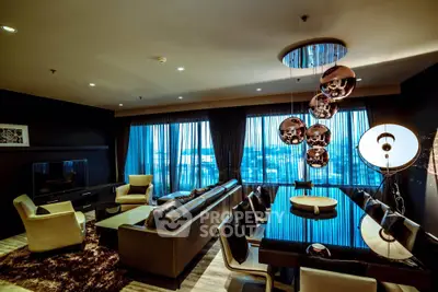 Luxurious modern living room with elegant lighting and panoramic city view.