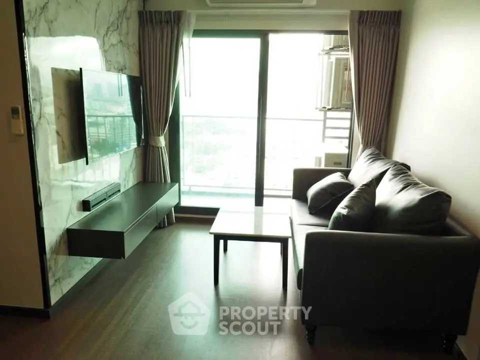 Modern living room with large window and stylish decor