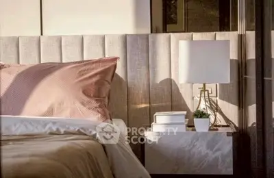 Luxurious bedroom with elegant headboard and stylish bedside lamp