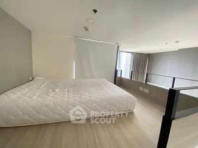 Modern loft bedroom with minimalist design and natural light