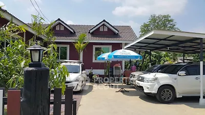 Charming suburban house with carport and lush greenery, perfect for family living.