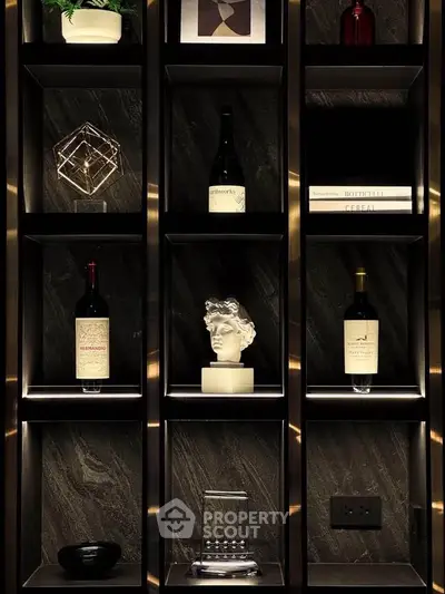 Luxurious modern shelving with artistic decor and wine bottles, perfect for elegant living room or study.