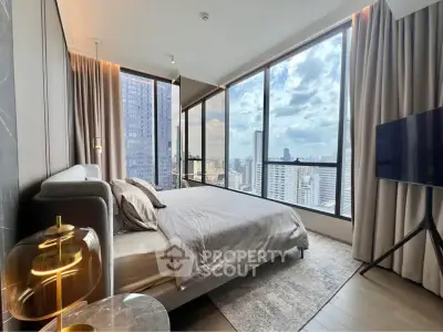 Luxurious bedroom with floor-to-ceiling windows offering stunning city views in a modern high-rise apartment.