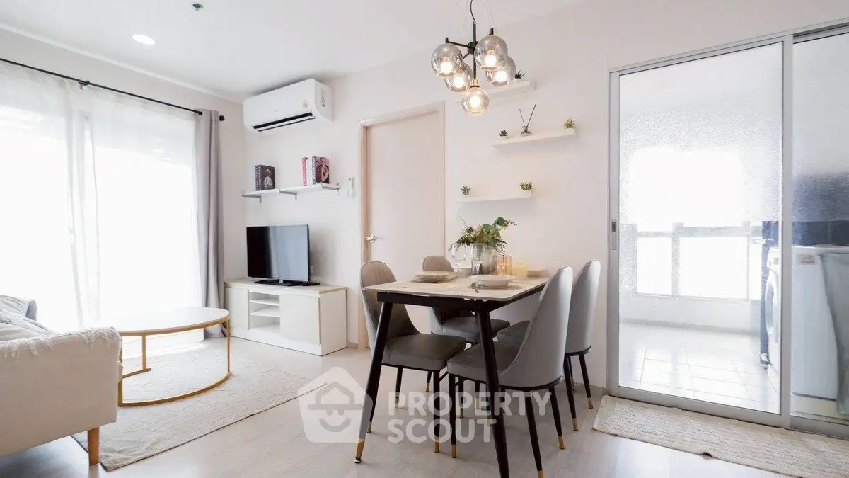 Modern living room with dining area and stylish lighting in a bright apartment