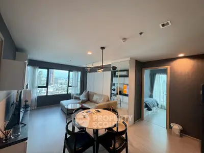 Spacious modern living room with city view, open layout, and stylish furniture in a high-rise apartment.