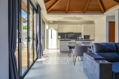 Luxurious open-plan living room with modern kitchen and large windows