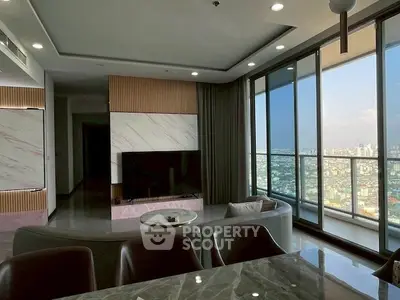 Luxurious living room with panoramic city view and modern interior design.