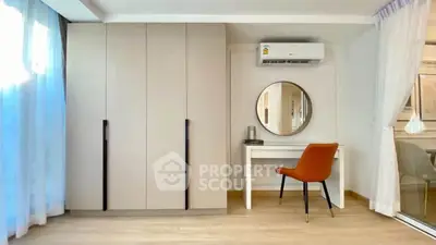 Stylish bedroom with modern wardrobe and elegant vanity setup