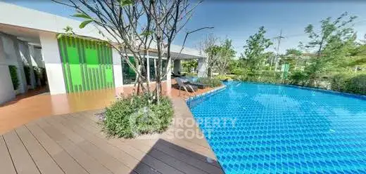 Luxurious outdoor pool area with lush greenery and modern design, perfect for relaxation and leisure.