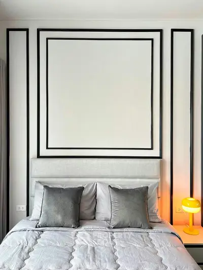 Modern bedroom with stylish decor and cozy lighting