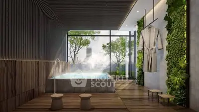Luxurious spa-like bathroom with indoor pool and greenery, offering a serene escape.