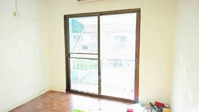 Bright room with large sliding glass door and wooden floor