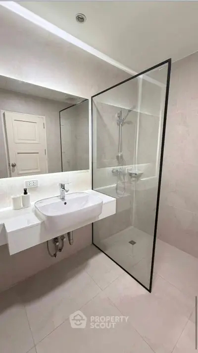 Modern bathroom with sleek glass shower and minimalist design