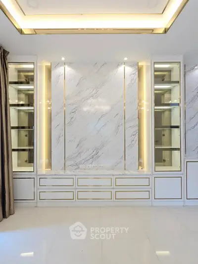 Luxurious modern living room with elegant marble wall and built-in cabinets