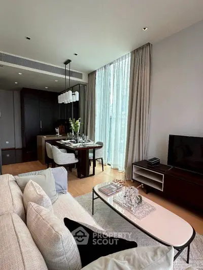 Luxurious modern living room with elegant dining area and floor-to-ceiling windows.