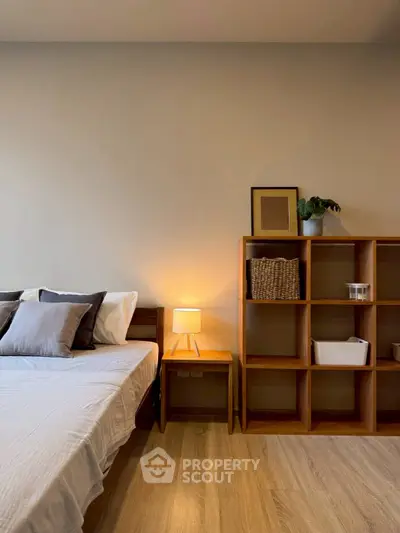 Modern bedroom with stylish wooden furniture and cozy lighting