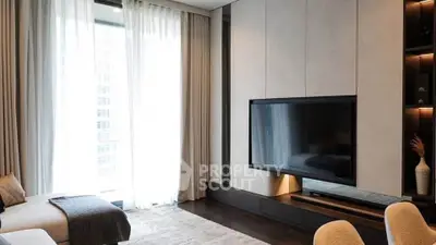 Luxurious modern living room with large TV and elegant decor