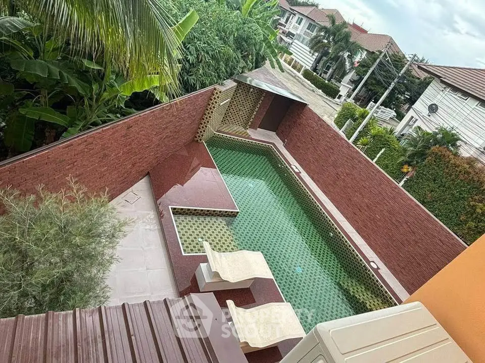 Luxurious private pool with stylish design in a tropical garden setting