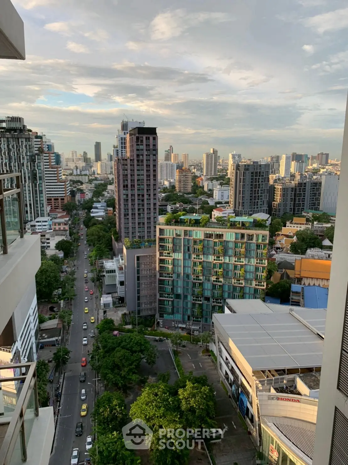 Stunning cityscape view from high-rise balcony overlooking urban skyline