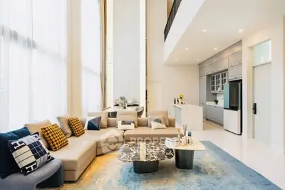 Luxurious modern living room with high ceilings and elegant decor
