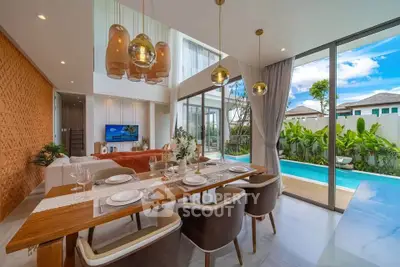 Luxurious open-plan living room with pool view and elegant dining area in modern villa.