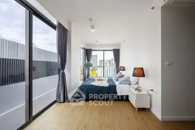 Modern bedroom with large windows and stylish decor