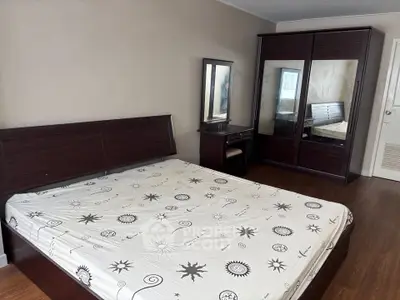 Spacious bedroom with elegant wooden furniture and stylish decor