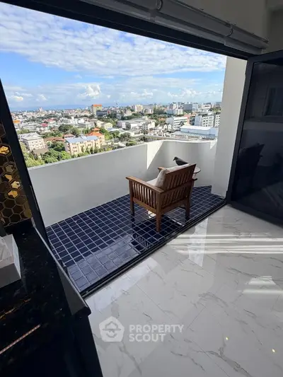 Luxurious balcony with stunning city view and elegant seating area