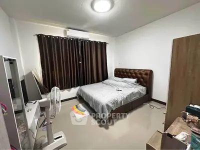 Cozy bedroom with modern furnishings and natural light