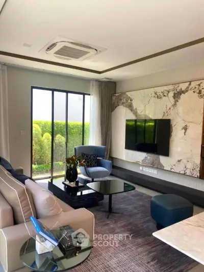 Luxurious living room with modern decor and large window view