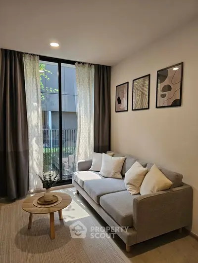 Modern living room with stylish decor and large window view
