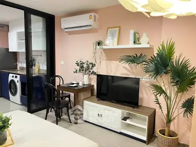 Modern living room with stylish decor, air conditioning, and compact dining area in a cozy apartment.