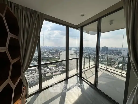 Stunning corner unit with panoramic city and river views from floor-to-ceiling windows.