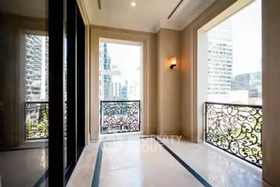 Elegant balcony with ornate railings and city view, perfect for urban living.
