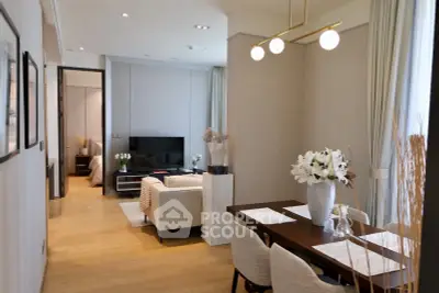 Elegant open-plan living and dining area with modern decor and natural light.
