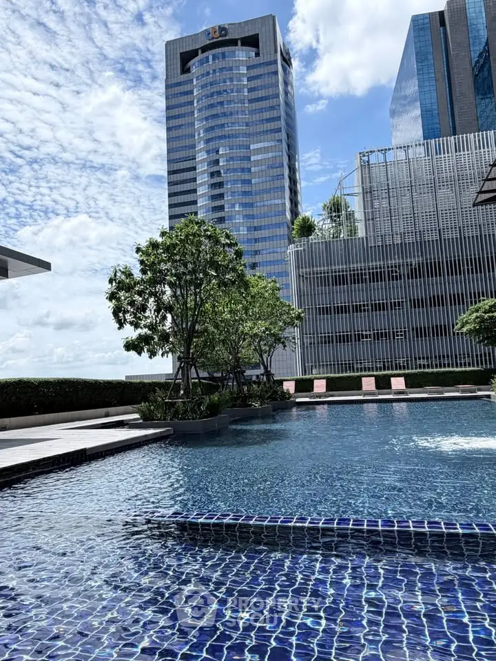Luxurious rooftop pool with stunning cityscape views and modern architecture.