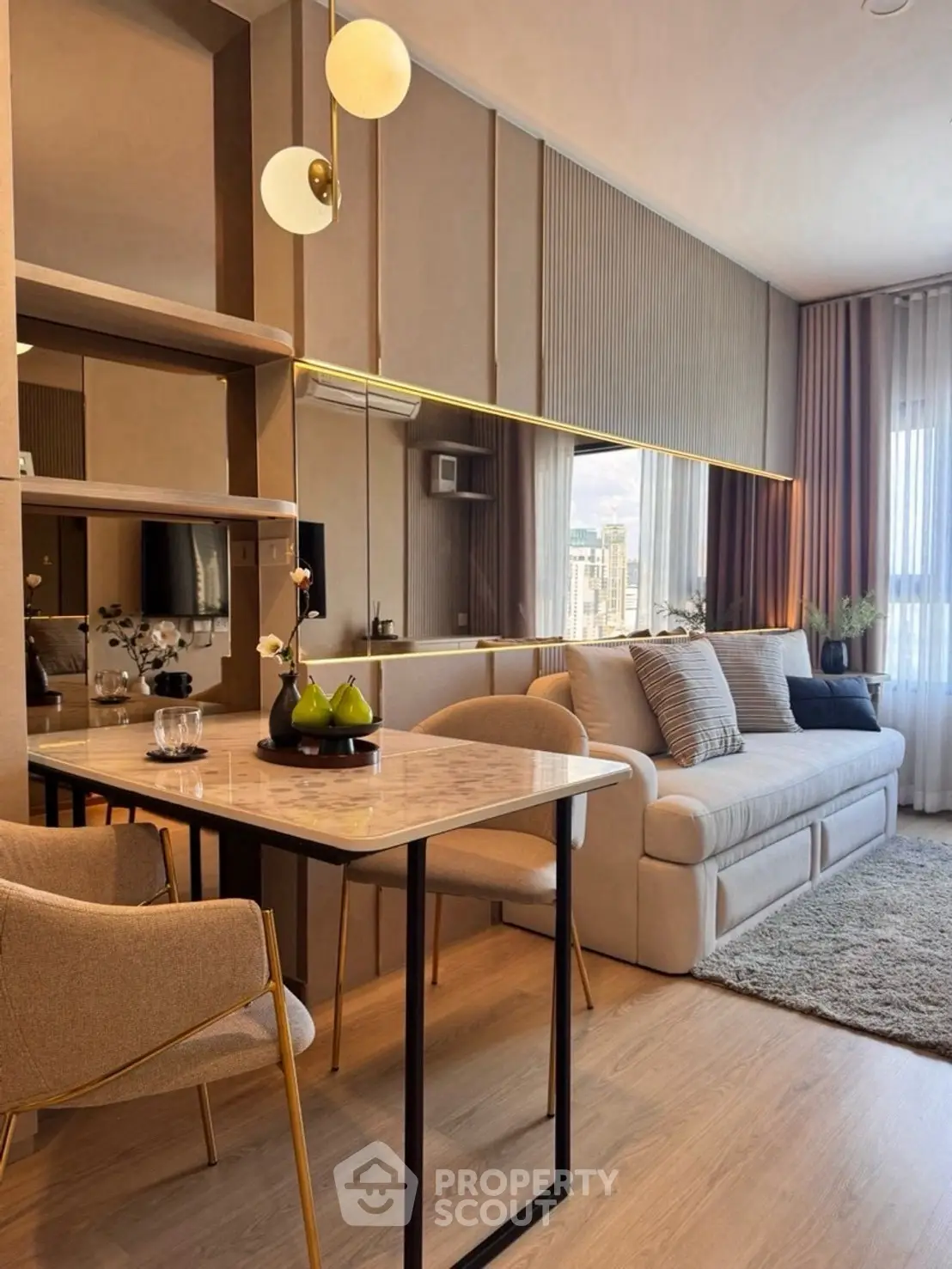 Modern living room with elegant decor and large mirror enhancing space