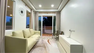Modern living room with elegant decor and balcony view