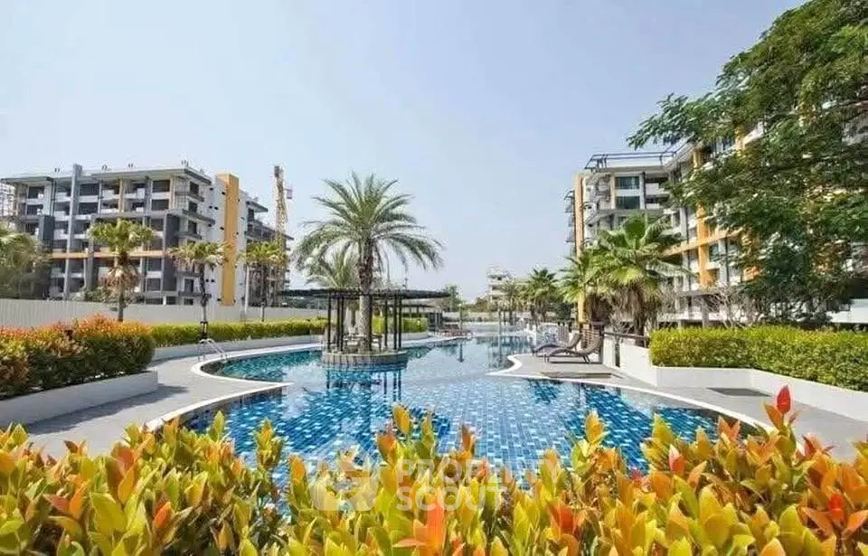 Luxurious residential complex with stunning pool and lush landscaping