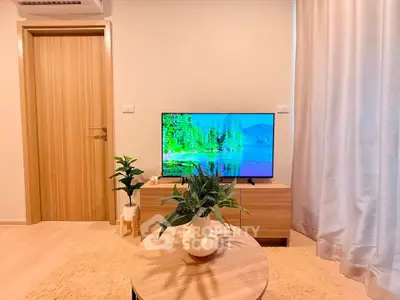 Modern living room with stylish decor and flat-screen TV