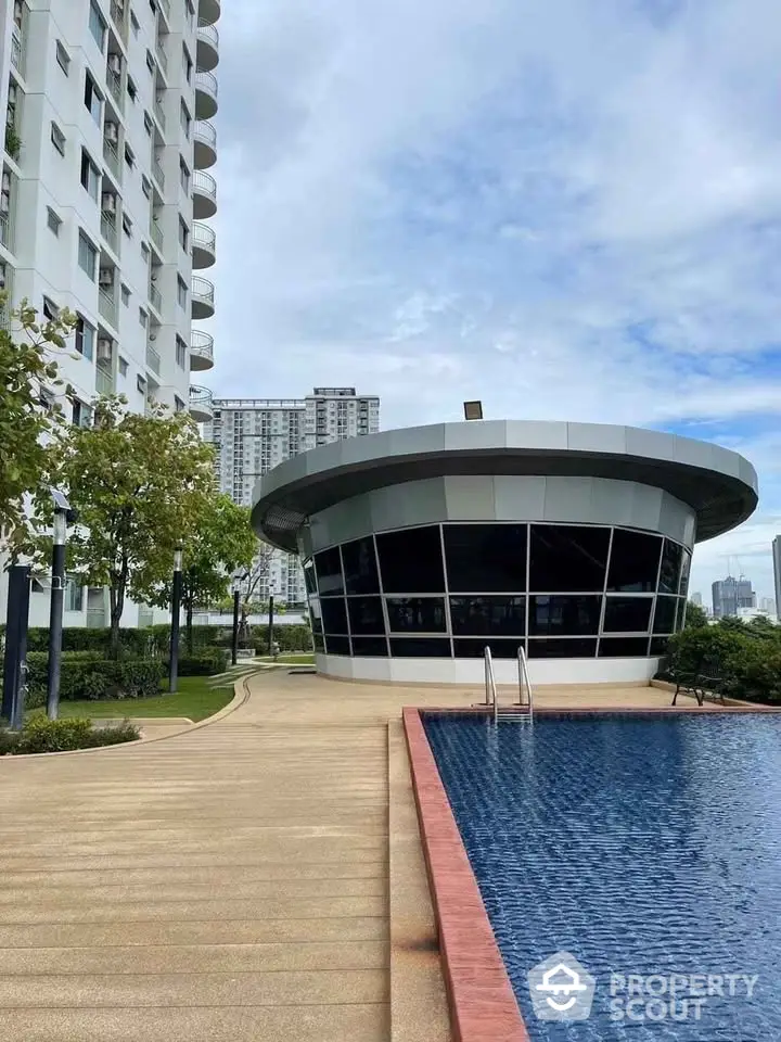 Modern apartment building with pool and garden view