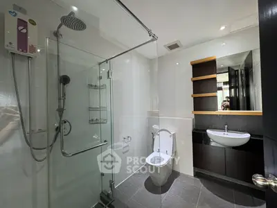 Modern bathroom with glass shower and sleek fixtures