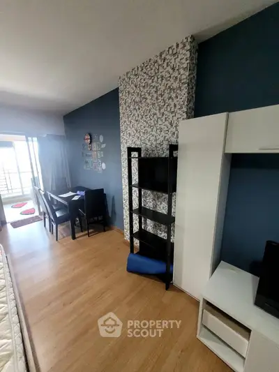 Modern living room with stylish decor and balcony access