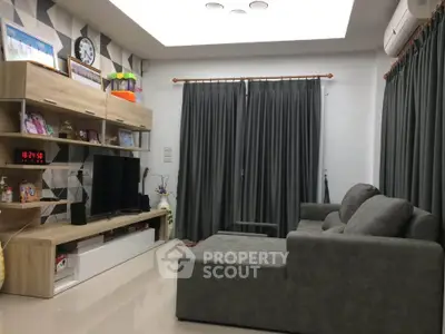 Modern living room with stylish furniture and entertainment center